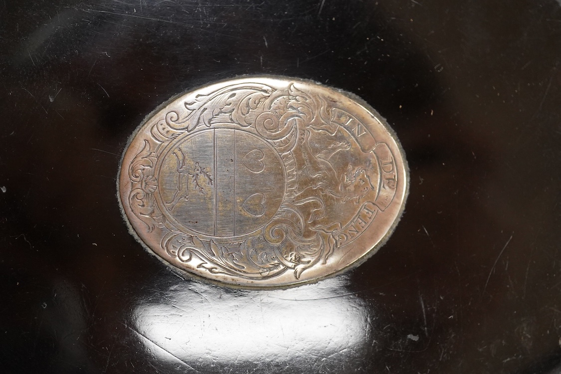 A 19th century white metal mounted tortoiseshell oval snuff box, with inset oval white metal plaque engraved with family crest, unmarked, 10.1cm.